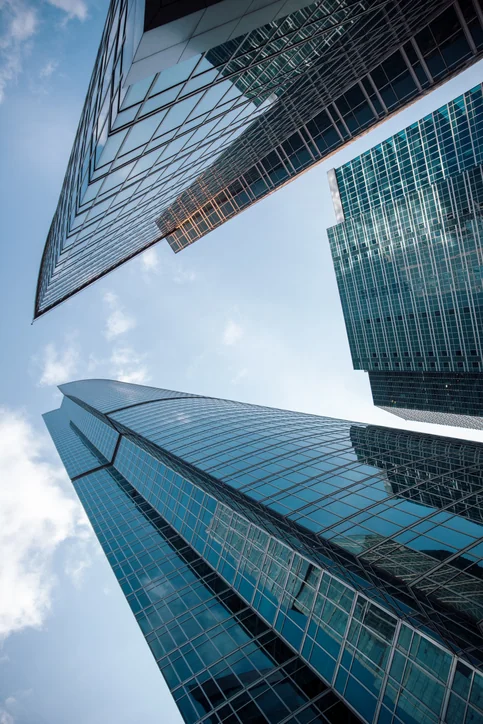 Bottom view of the tall skyscrapers of the business district of a modern city